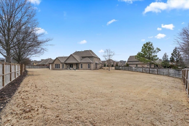 view of yard with a fenced backyard