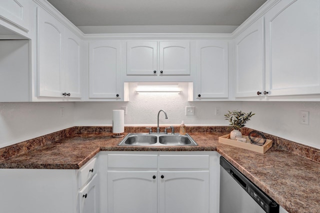 kitchen featuring stainless steel dishwasher, white cabinetry, and a sink