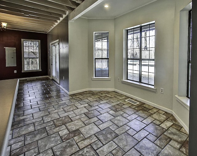 entryway with recessed lighting, visible vents, baseboards, ornamental molding, and electric panel