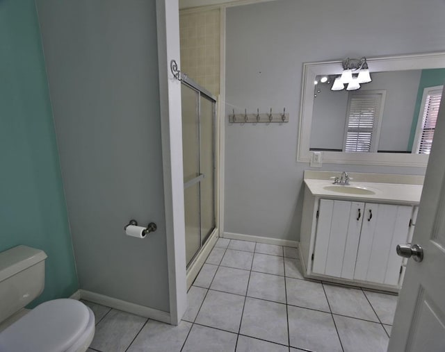 full bathroom with vanity, a stall shower, tile patterned flooring, and toilet