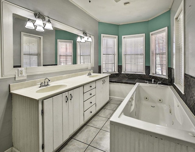 bathroom with crown molding, double vanity, a sink, and tile patterned floors