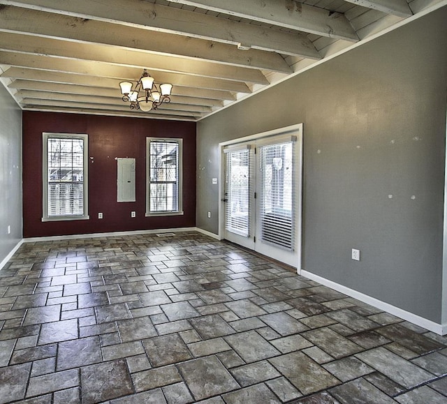 entryway with baseboards, beamed ceiling, and a notable chandelier