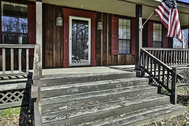 view of exterior entry featuring a porch