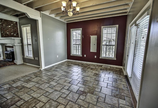 foyer entrance featuring a fireplace with raised hearth, a chandelier, electric panel, beamed ceiling, and baseboards