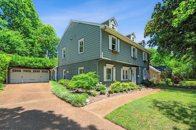 view of front of home with a front lawn and brick siding