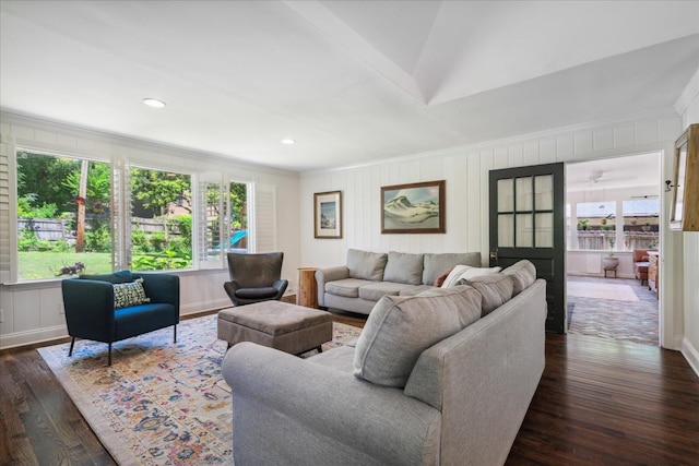 living area with ornamental molding, dark wood-type flooring, and recessed lighting