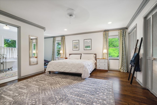 bedroom with ornamental molding, recessed lighting, multiple closets, and wood finished floors