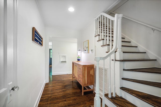 interior space with wood finished floors, visible vents, and baseboards