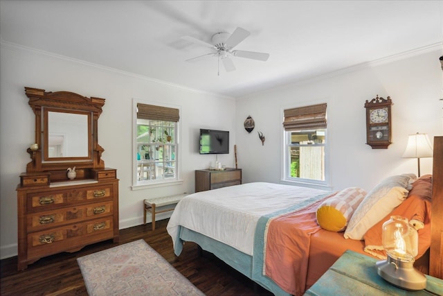 bedroom featuring ornamental molding, dark wood-style flooring, a ceiling fan, and baseboards