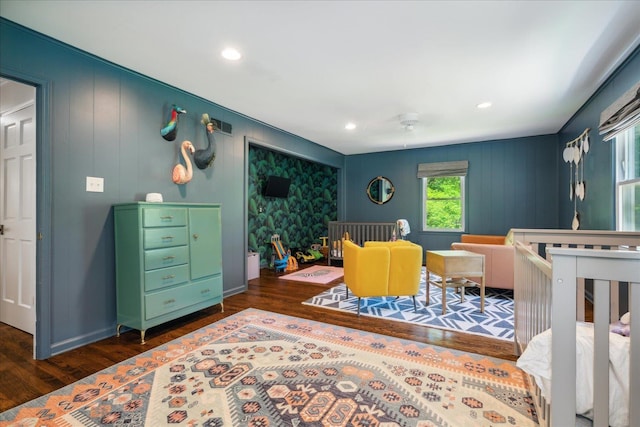 bedroom featuring dark wood-style floors, baseboards, and recessed lighting