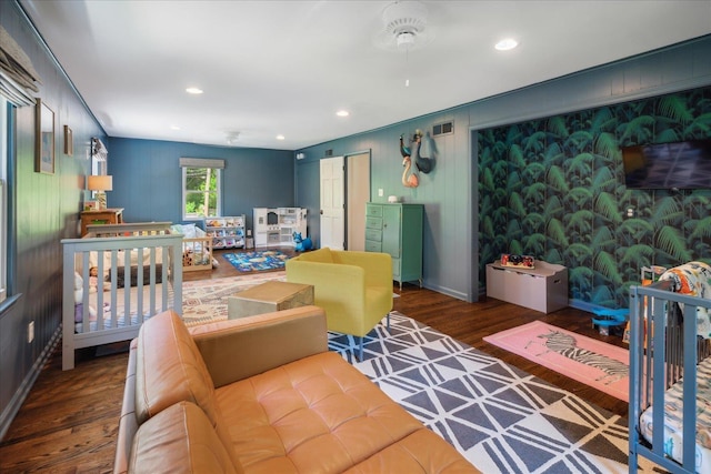 bedroom featuring baseboards, wood finished floors, visible vents, and recessed lighting