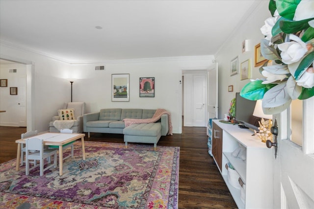 living room featuring dark wood-style floors, visible vents, and crown molding