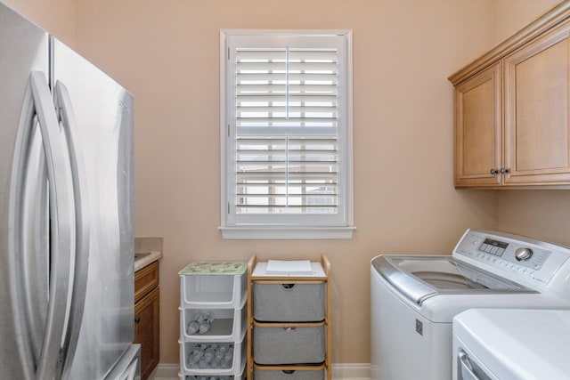 laundry room with cabinet space and independent washer and dryer