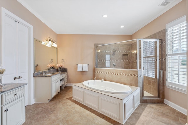 full bathroom featuring a garden tub, vanity, a shower stall, and visible vents