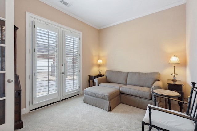 carpeted living area featuring ornamental molding and visible vents