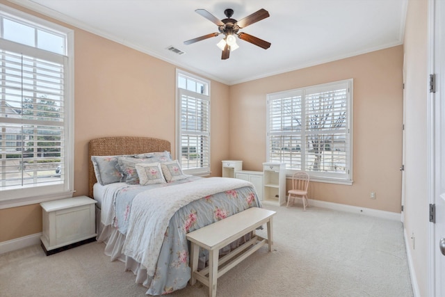 bedroom with carpet, multiple windows, baseboards, and crown molding