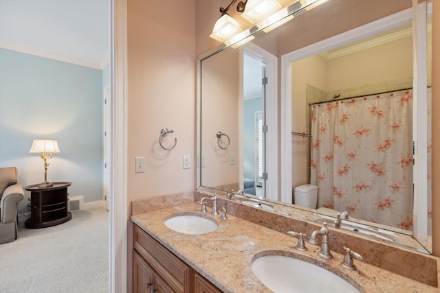 full bathroom featuring double vanity, a shower with shower curtain, a sink, and crown molding