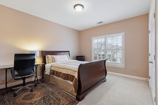 bedroom featuring carpet floors, visible vents, and baseboards