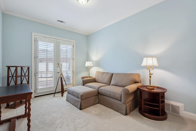 carpeted living area with ornamental molding, visible vents, and baseboards