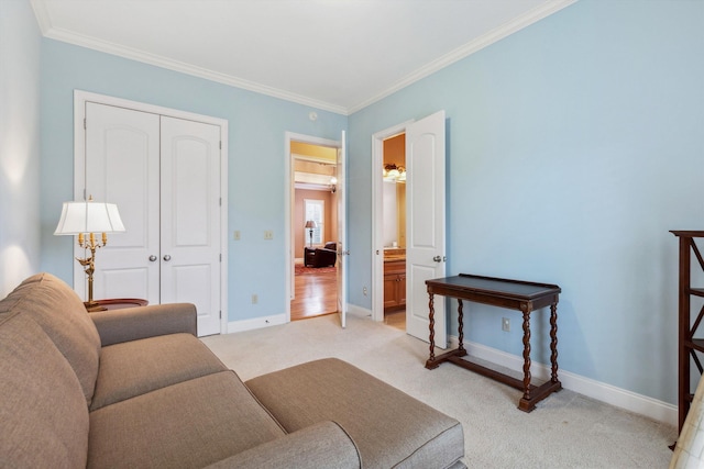 living area with baseboards, ornamental molding, and light colored carpet