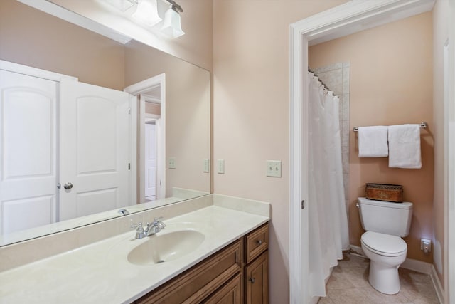 full bath with tile patterned flooring, baseboards, vanity, and toilet