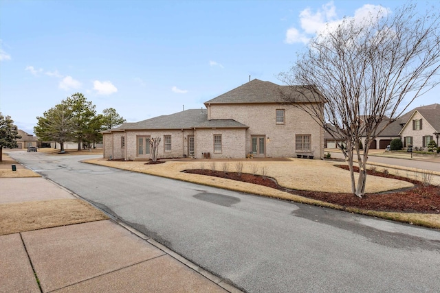 view of front of house featuring brick siding