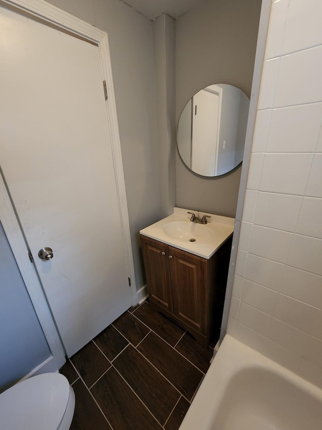 bathroom with toilet and vanity