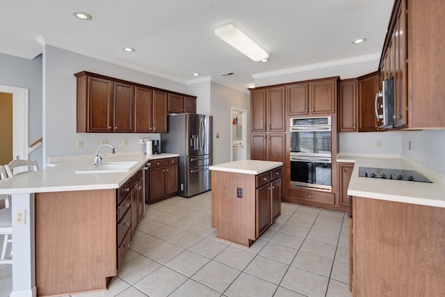 kitchen with a center island, light tile patterned floors, stainless steel appliances, ornamental molding, and a sink