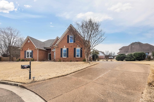 traditional home featuring brick siding