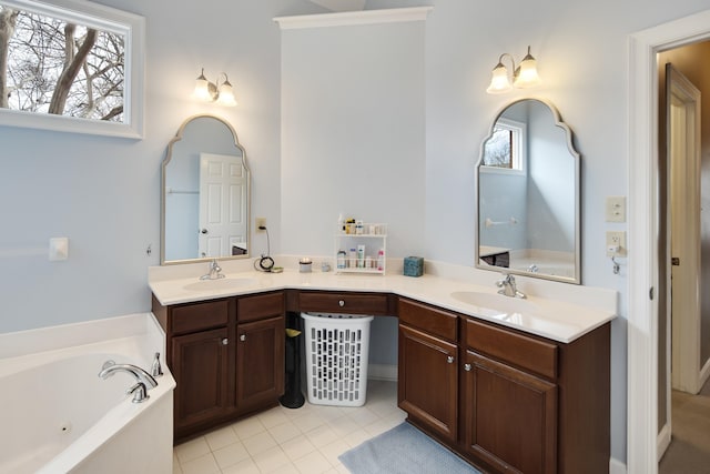 bathroom with tile patterned flooring, a sink, a whirlpool tub, and double vanity