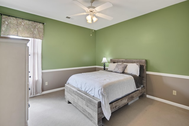 bedroom with baseboards, visible vents, and carpet flooring