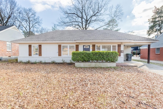 ranch-style house featuring an attached carport, crawl space, brick siding, and roof with shingles