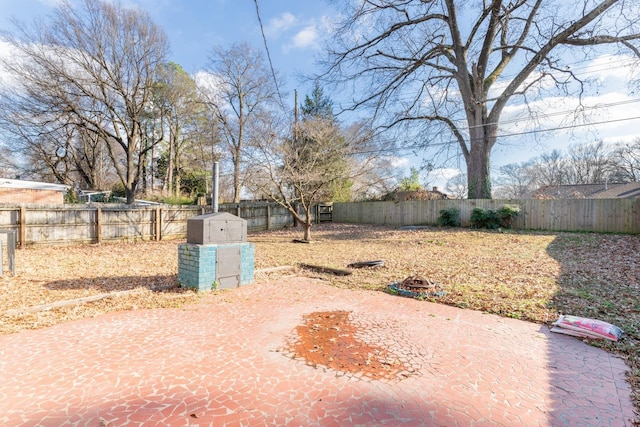 view of yard featuring an outbuilding and a fenced backyard