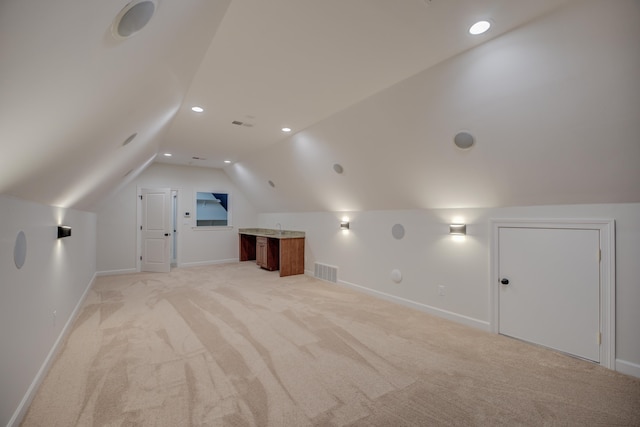 bonus room with recessed lighting, light carpet, visible vents, baseboards, and vaulted ceiling