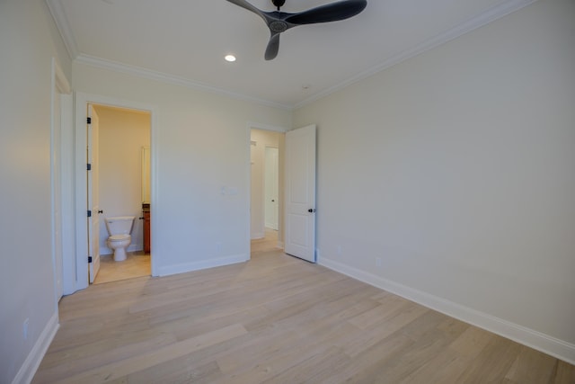 unfurnished bedroom featuring light wood-style floors, ornamental molding, and baseboards