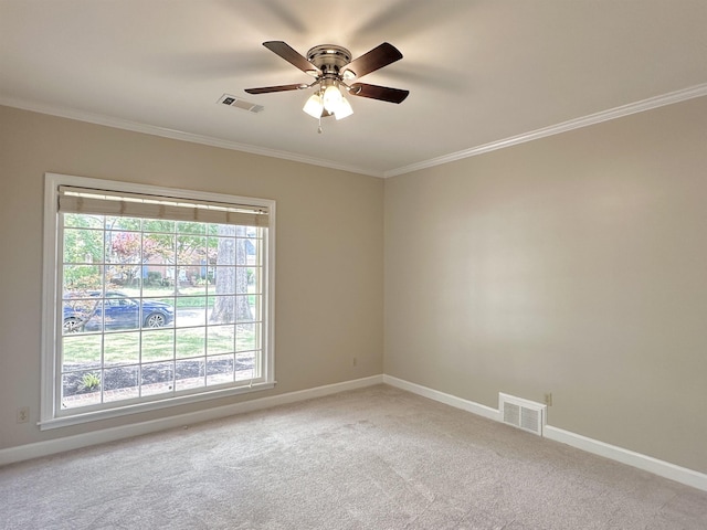 empty room with light carpet, visible vents, and crown molding