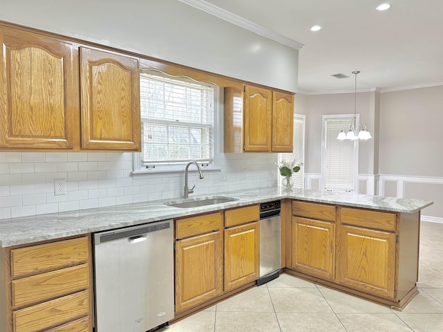 kitchen featuring crown molding, brown cabinetry, a sink, dishwasher, and a peninsula