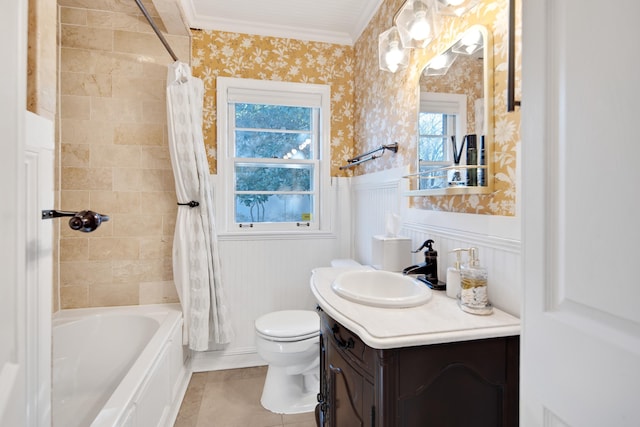 bathroom with a wainscoted wall, shower / tub combo with curtain, toilet, vanity, and wallpapered walls