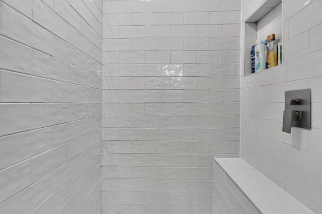 bathroom featuring tiled shower