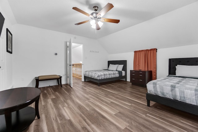 bedroom with lofted ceiling, ceiling fan, and wood finished floors