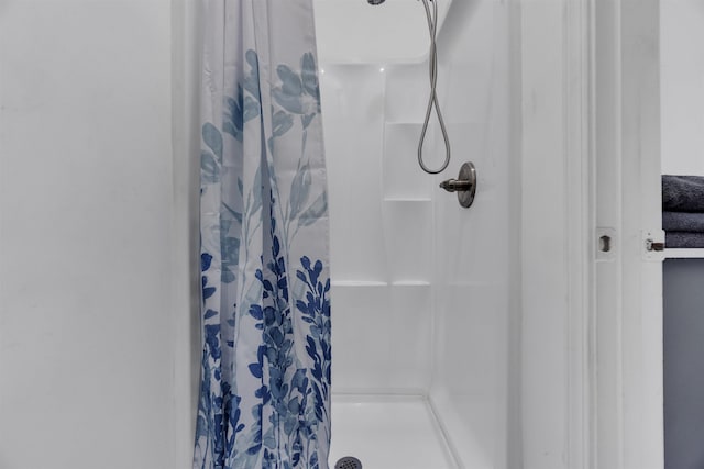 bathroom with a shower stall