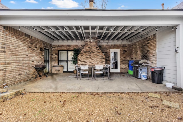 view of patio / terrace with a ceiling fan, outdoor dining area, and area for grilling