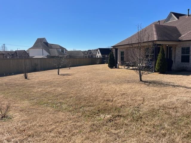 view of yard with a fenced backyard