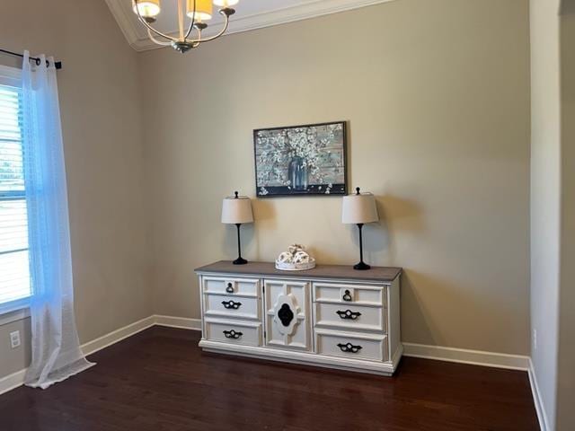 room details with an inviting chandelier, baseboards, and wood finished floors