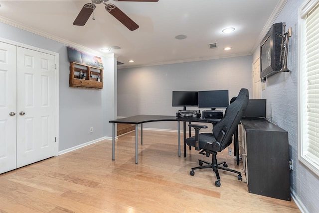 office space featuring visible vents, crown molding, light wood-style flooring, and baseboards