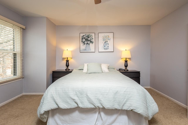 bedroom with carpet floors, ceiling fan, and baseboards