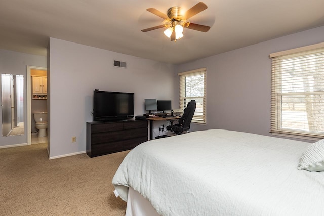 bedroom featuring connected bathroom, light carpet, a ceiling fan, visible vents, and baseboards