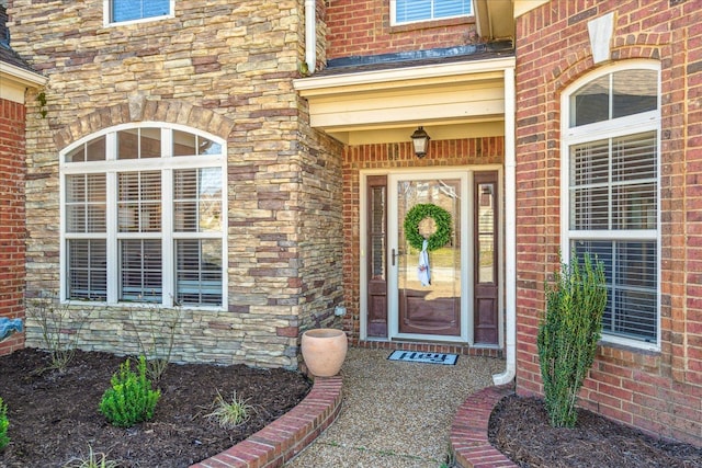 doorway to property featuring stone siding