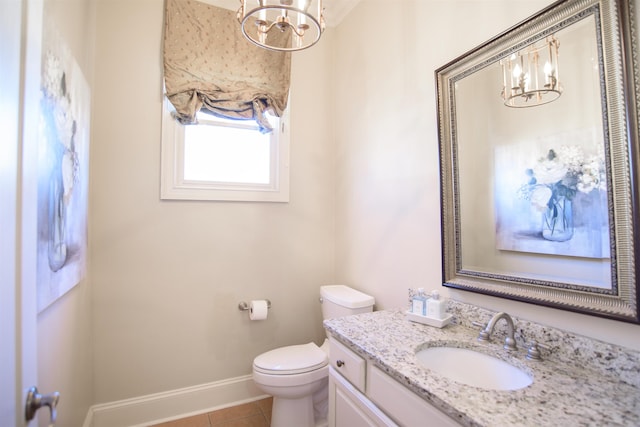 bathroom with toilet, an inviting chandelier, baseboards, and tile patterned floors