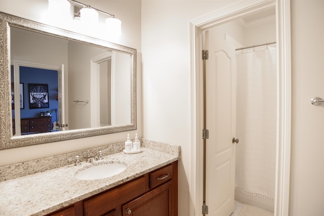 bathroom with ornamental molding, a shower with curtain, and vanity